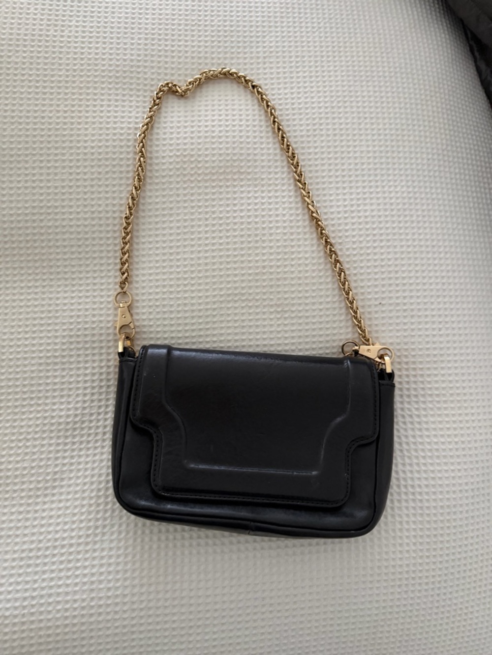 Compact Black Shoulder Bag with Gold Chain Strap